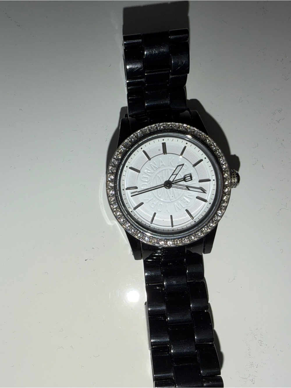 Donna Karan Black Bracelet Watch with White Dial and Crystal Bezel Accents